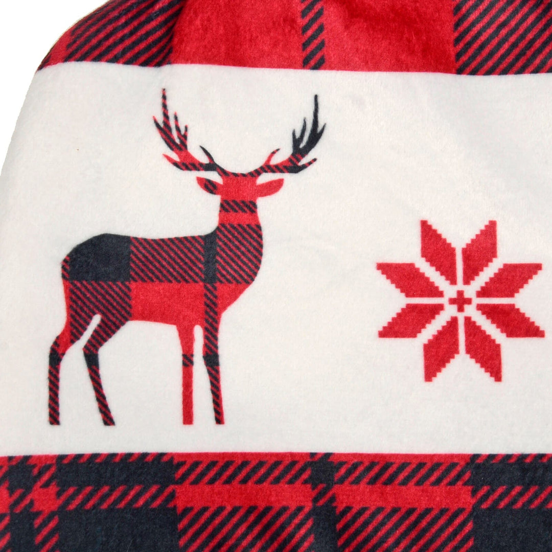 Close up of a red reindeer and snowflake Christmas tartan pattern