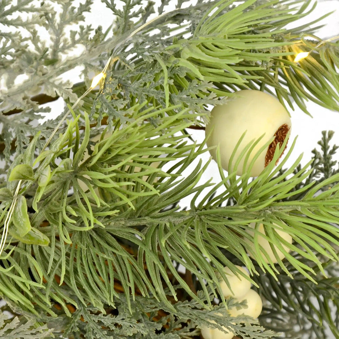 green larch branches and snowberries with warm white micro LED  lights