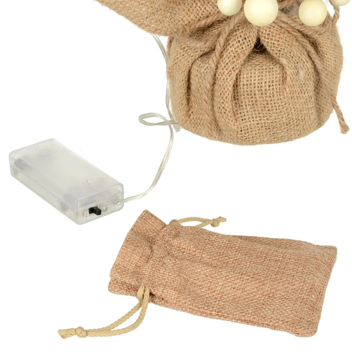 Cloth fabric drawstring bag for battery pack to power a Christmas tree with white berries