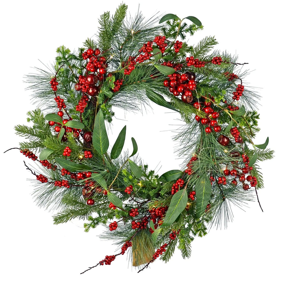 Christmas wreath with red berries, green leaves pine branches and fairy lights