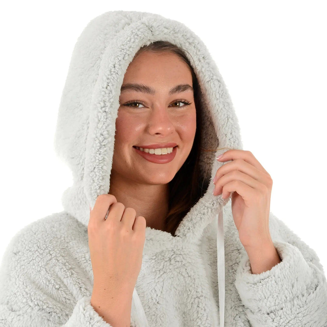 Close up of woman with hood up on a grey Sherpa fleece hoodie