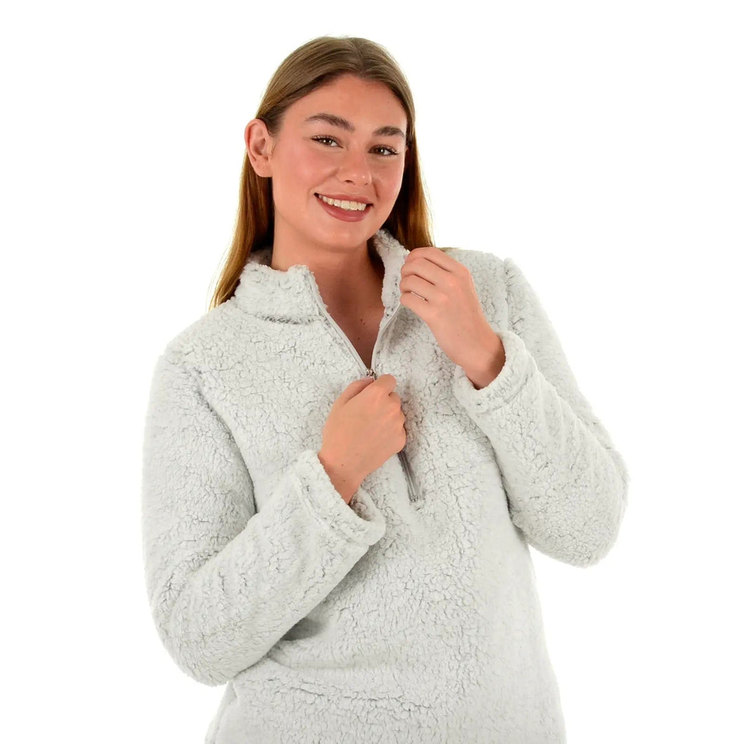 Close up of lady wearing thick grey fleece top with zip