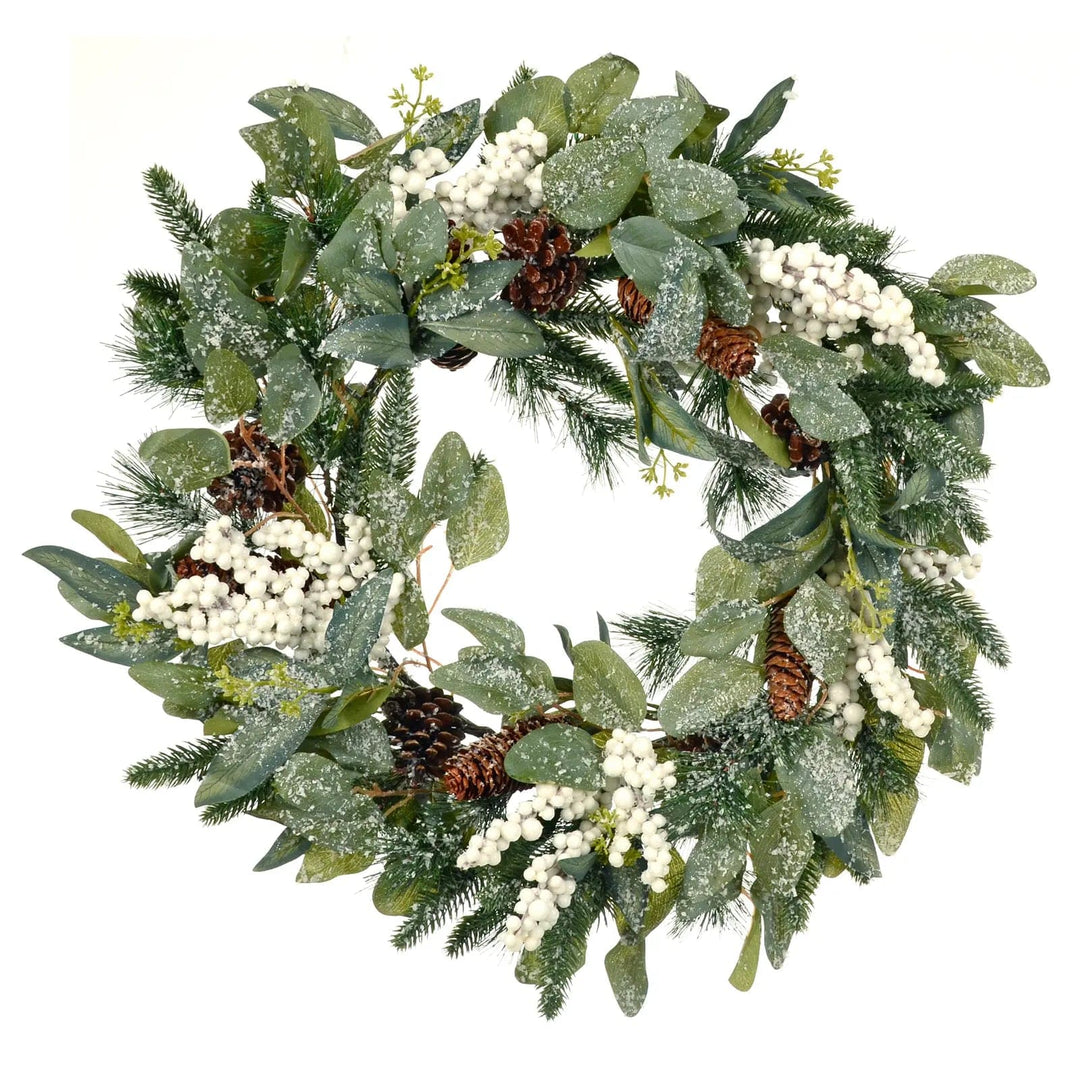 Large Christmas wreath with white berries, pine cones and green frosted branches