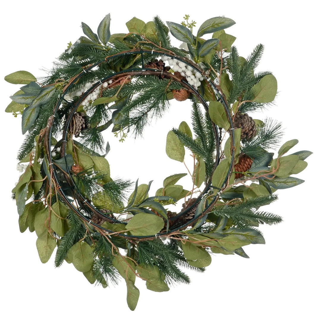 Back view of a Christmas wreath with green leaves and pine cones