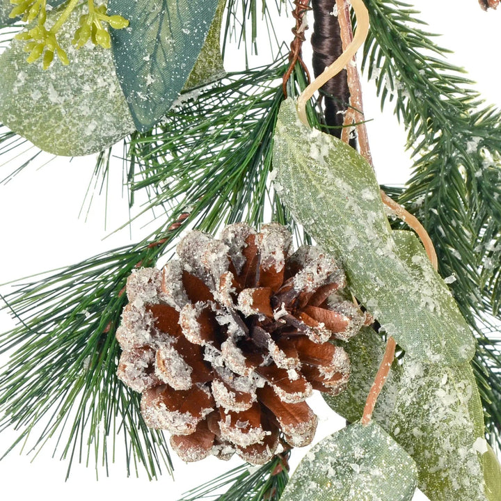 Close up of pine cone and spruce branches of an artificial Christmas Garland