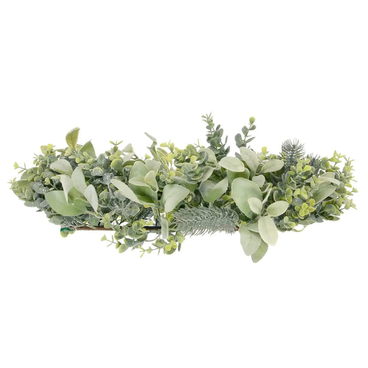 Side view of light green Christmas wreath with mixed branches