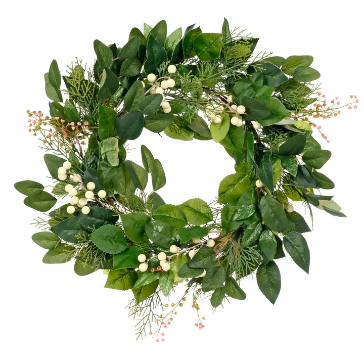 Green foliage Christmas wreath with white berries and little pink flowers