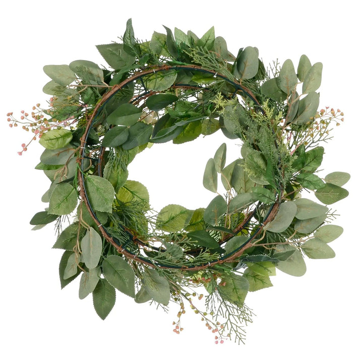 Wire frame on the back of a green Christmas wreath for hanging on your front door