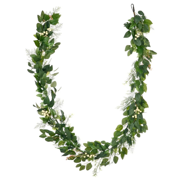 Green leaf Christmas garland with white berries and pink flowers