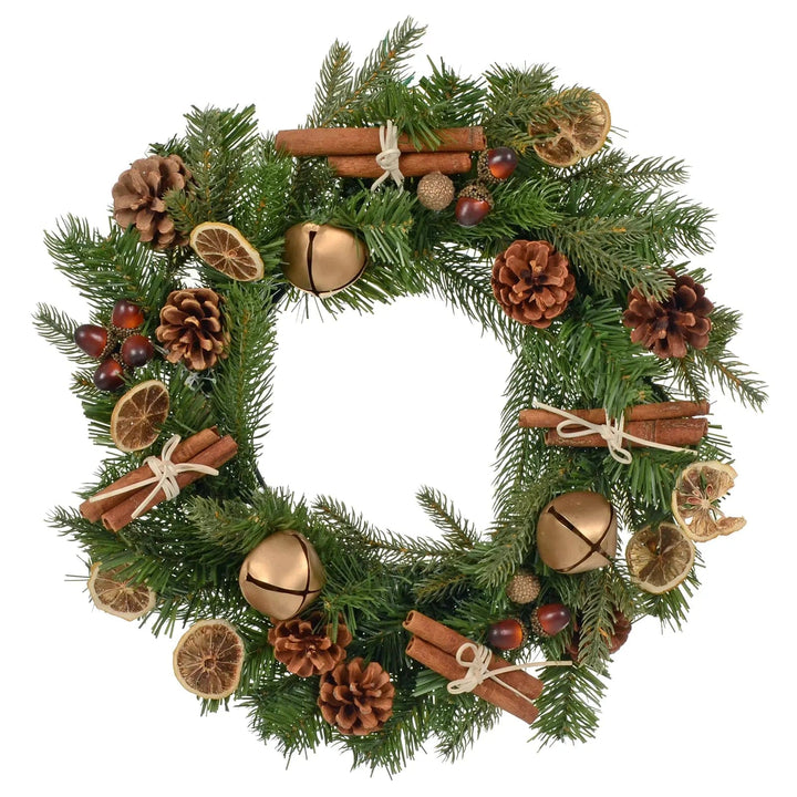 Christmas wreath with green branches, gold bells, pine cones, dried orange slice, cinnamon sticks and acorns