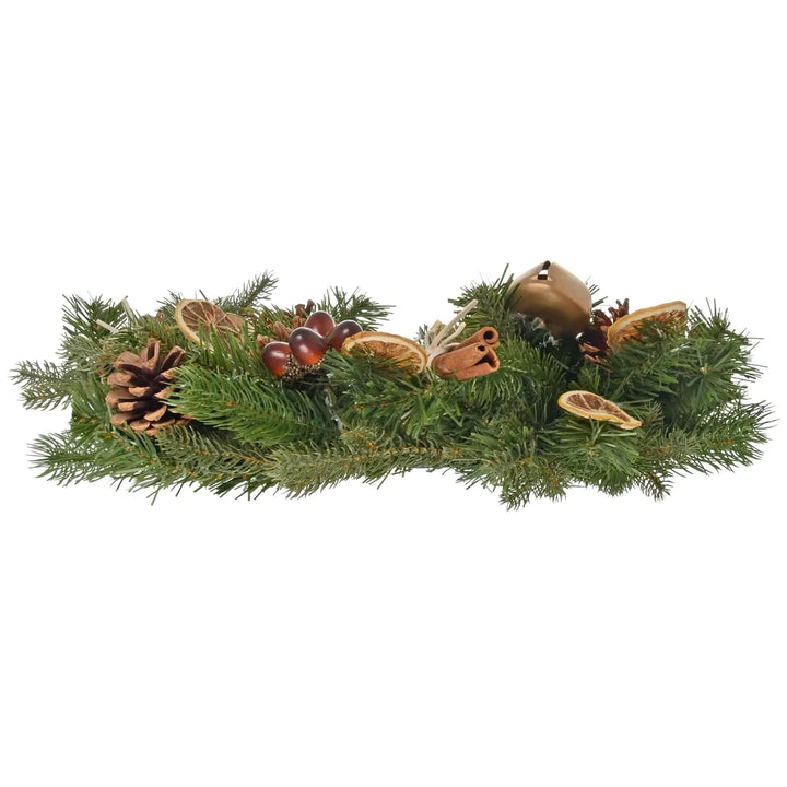 Side view of a Christmas wreath with green pine branches, cones, acorns and gold bells