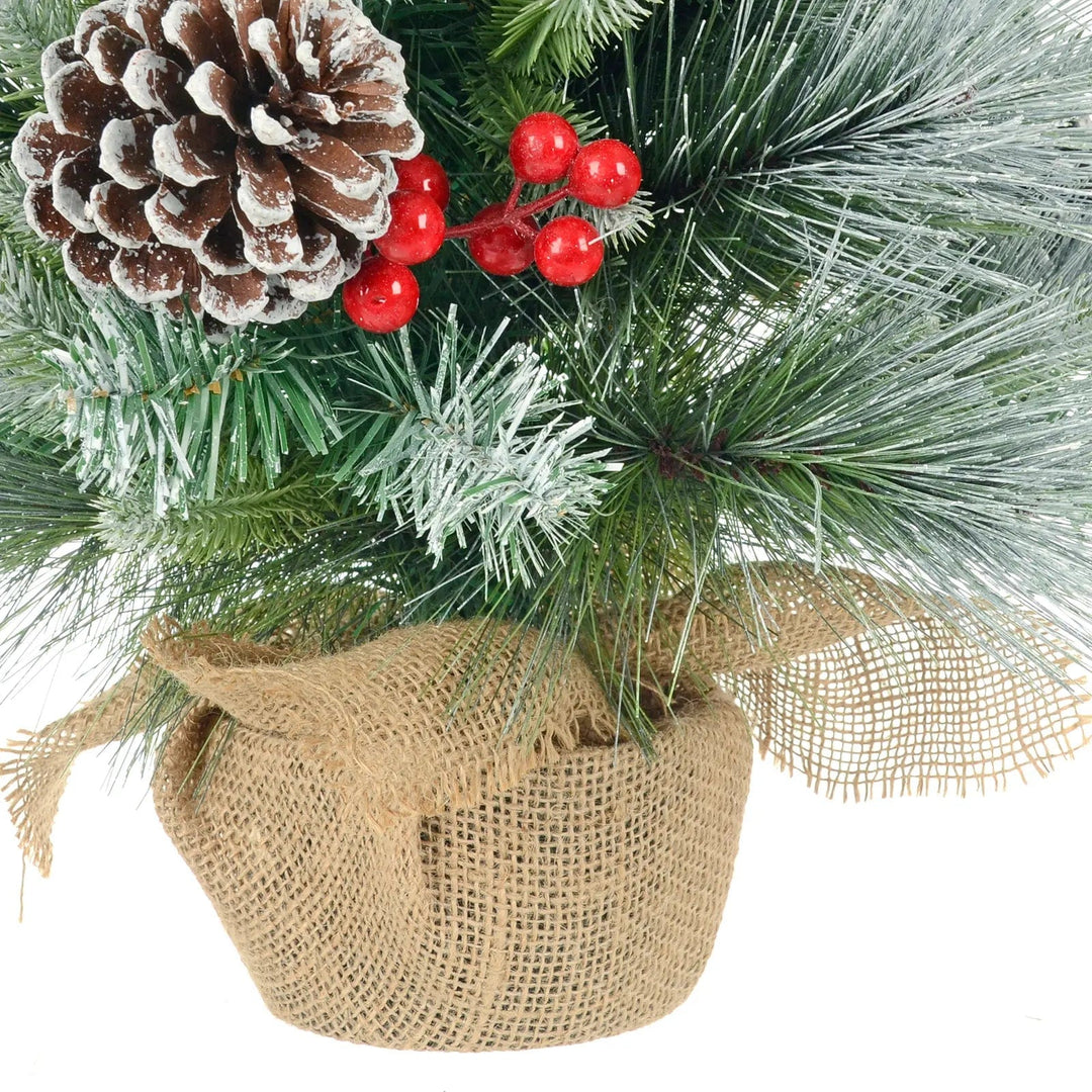 Close up of jute fabric covered base on a frosted green pine Christmas tree