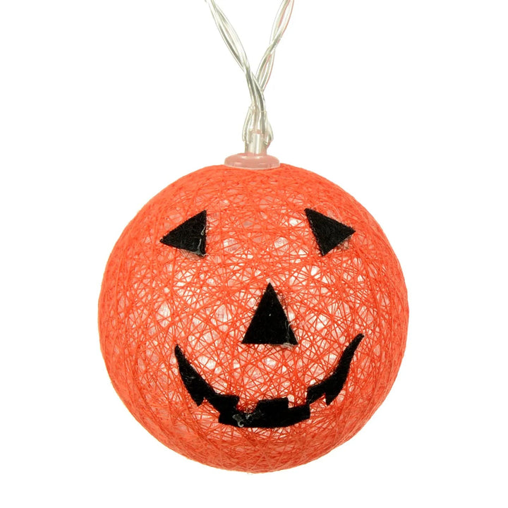 Close up of orange Halloween jack o' lantern light with clear wire