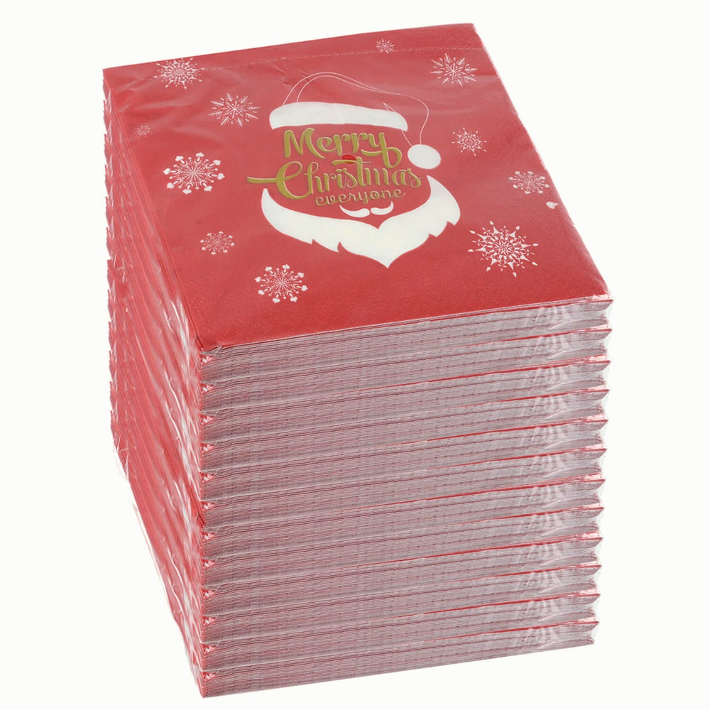 Stack of 12 packets of red white and gold Santa design paper napkins for Christmas on a white background