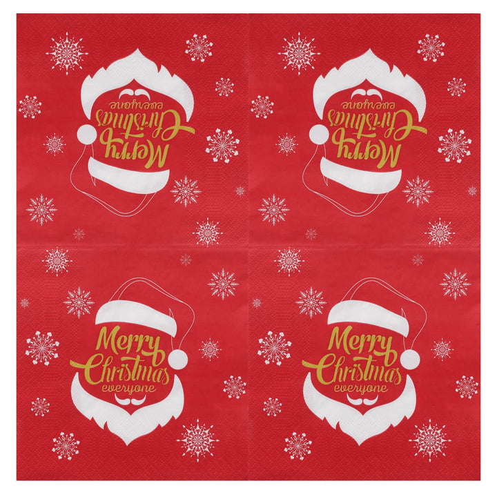 Red and white Christmas napkin unfolded to show each corner design