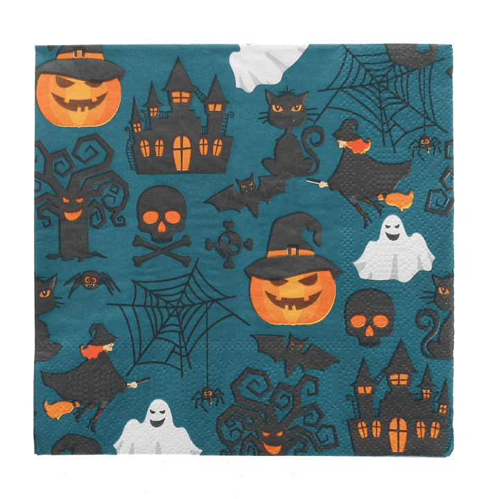 single napkin laid out on white background featuring all over halloween pattern with haunted houses, pumpkins, cobwebs, witches and more