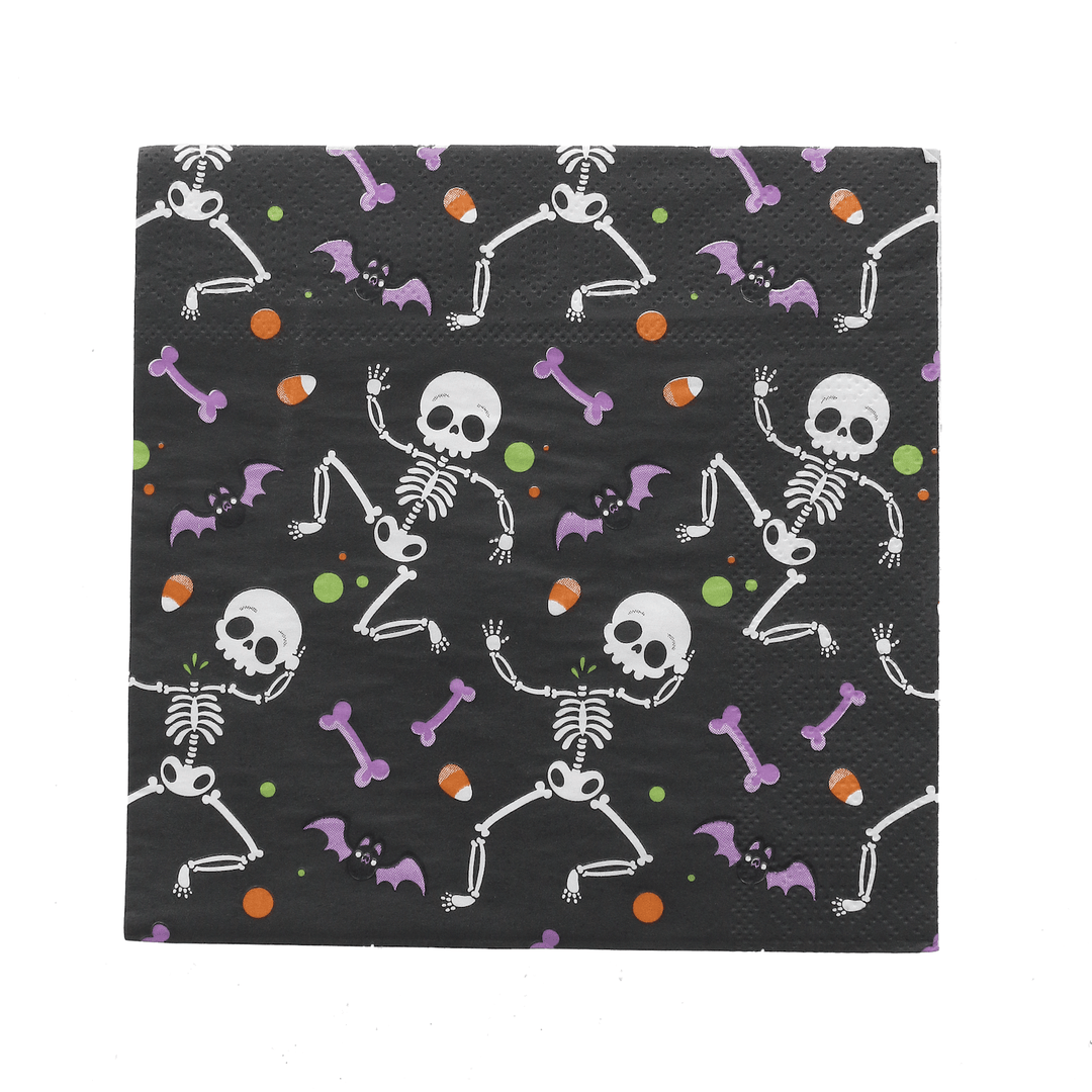 single black napkin featuring purple bats, orange candy corn, and dancing white skeletons