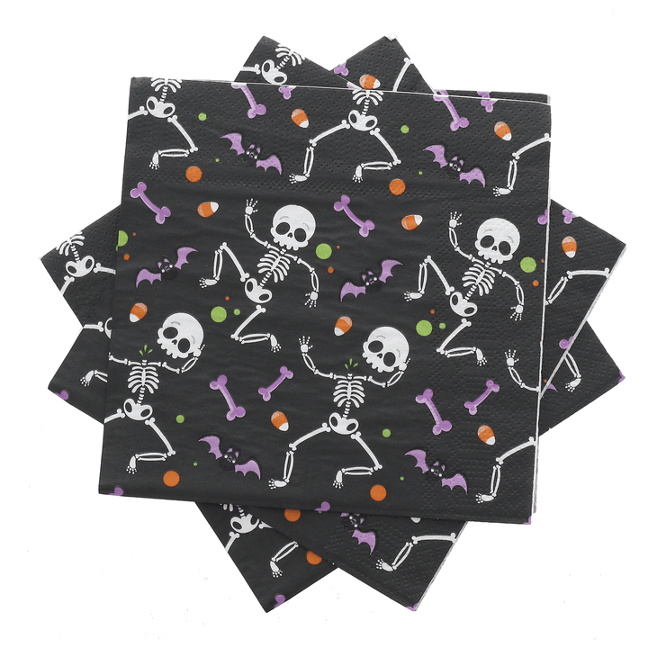 black napkins with dancing skeletons, candy corn and purple bat all over pattern