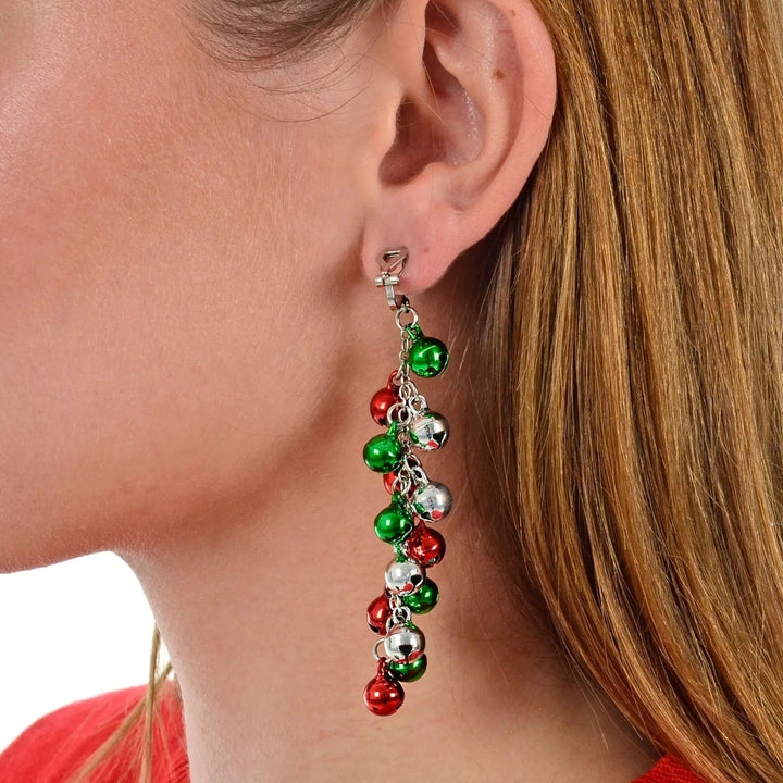 Model wearing jingle bell drop earrings with red, green and silver baubles