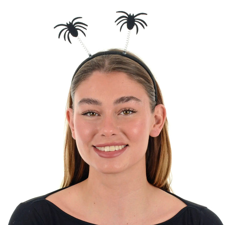 Female model wearing spider head boppers on a black hairband for Halloween parties