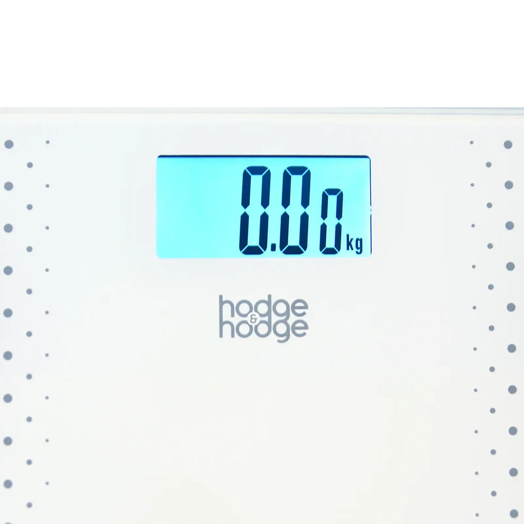 Close up of blue backlit LCD display window on white smart bathroom scales from hodge and hodge