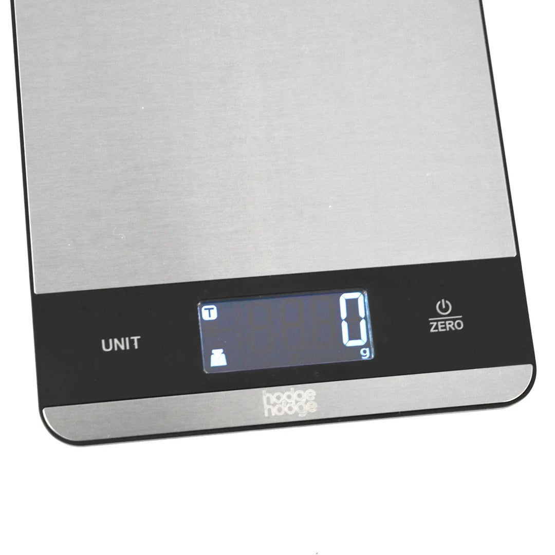 Close up of the LCD display on slim silver and black electronic kitchen scales