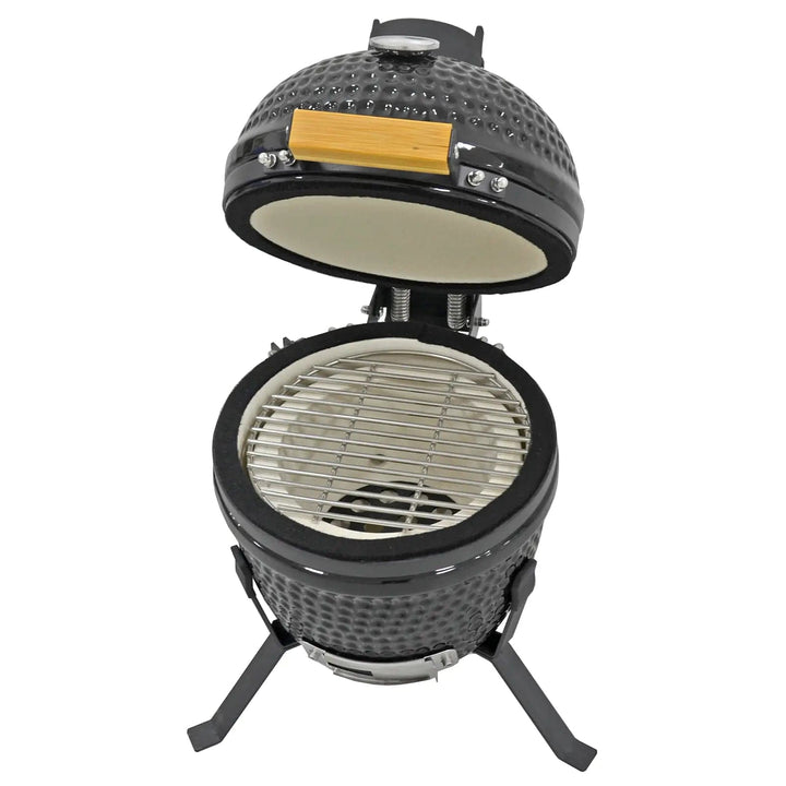 Ceramic barbecue with hinged lid open to show grill rack, double wall and charcoal rack