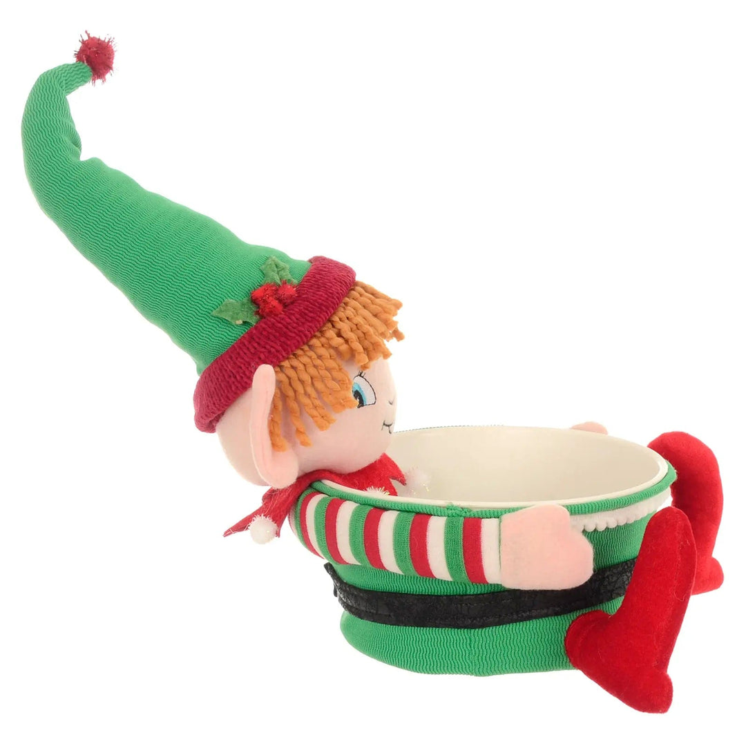 Side view of a green and red Christmas candy holder with elf figure