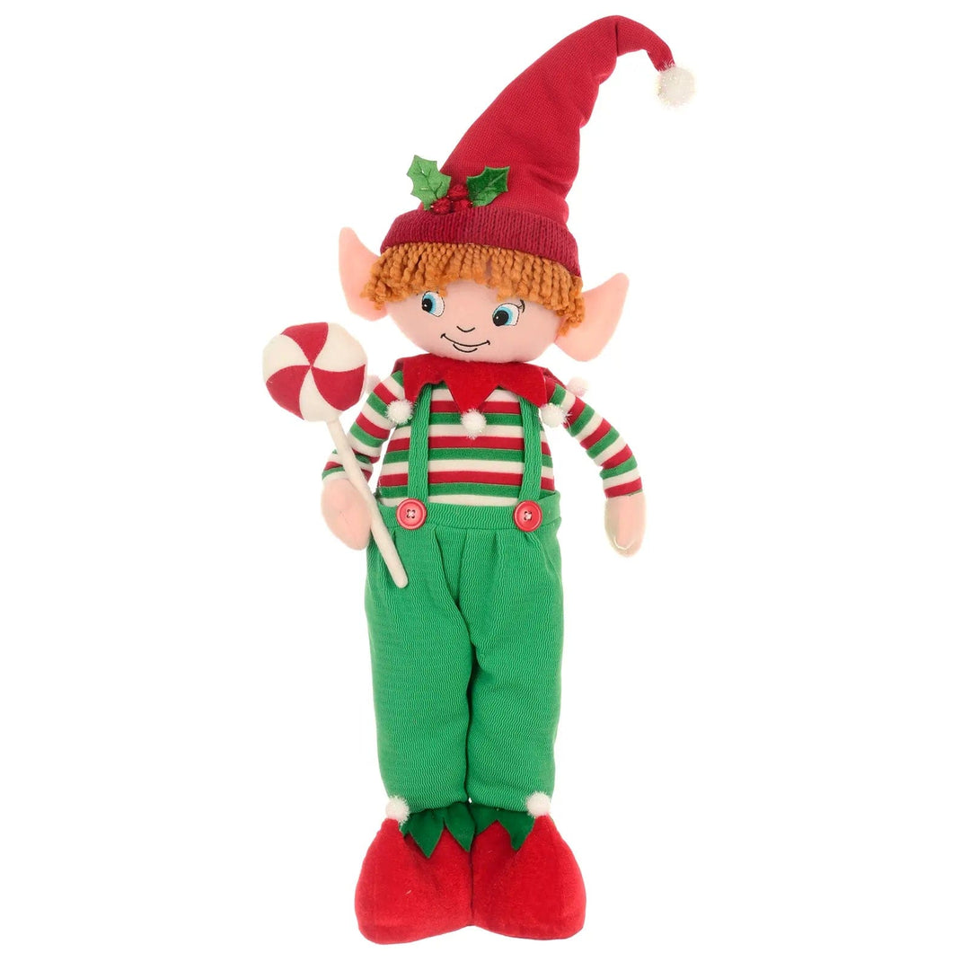 Christmas Elf boy figure standing with green dungarees holding a candy lollipop