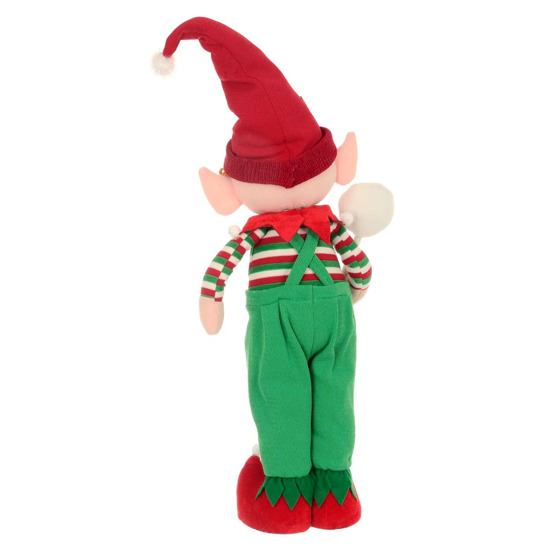 Back view of a standing Christmas elf figure with red, green and white striped jumper and green dungarees