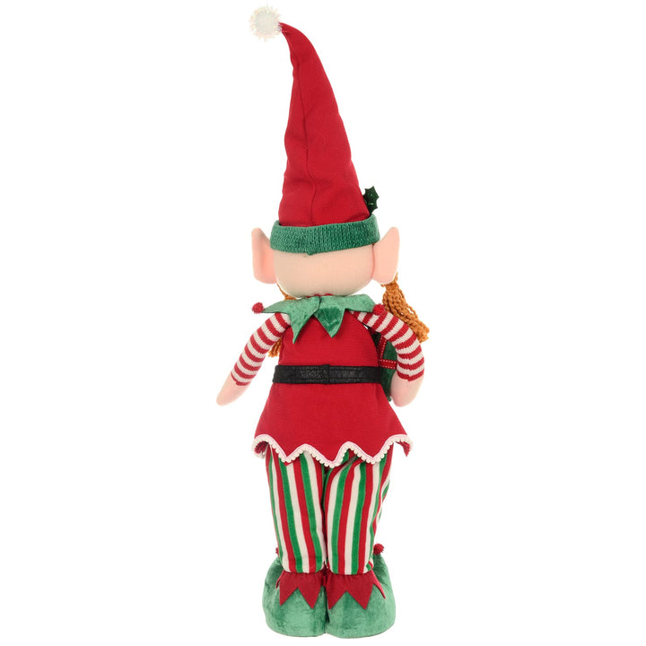 Back view of a standing Christmas elf figure with red, green and white striped trousers