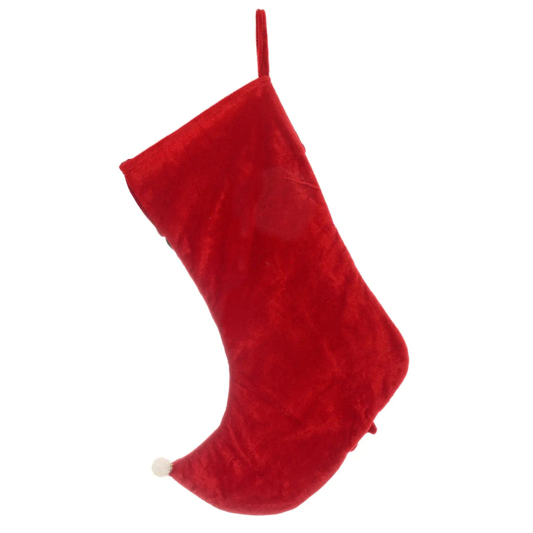 Back of a red Christmas stocking with white pom pom