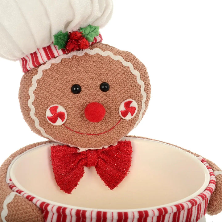 Detail of fabric gingerbread man holding a Christmas candy bowl