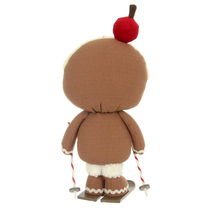 Back view of a skiing fabric gingerbread figure with fleece topped ski boots