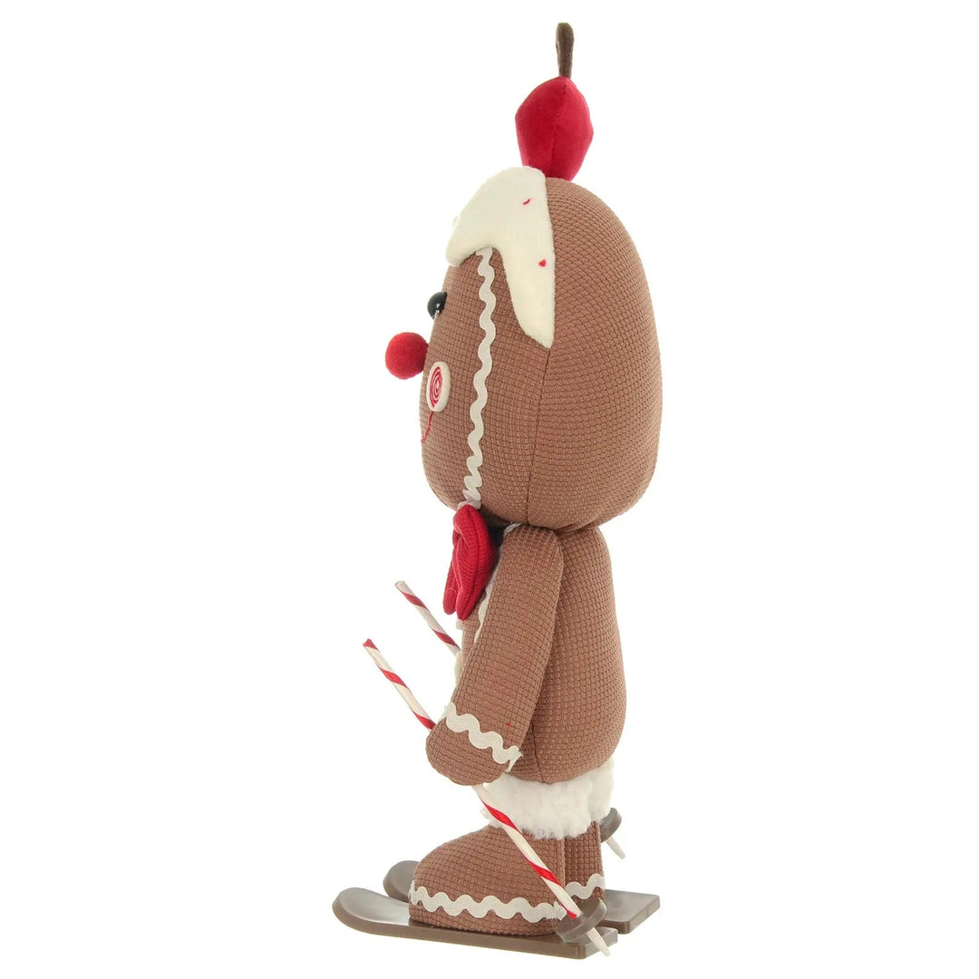 Side view of a Christmas Skiing gingerbread figure with skis and poles