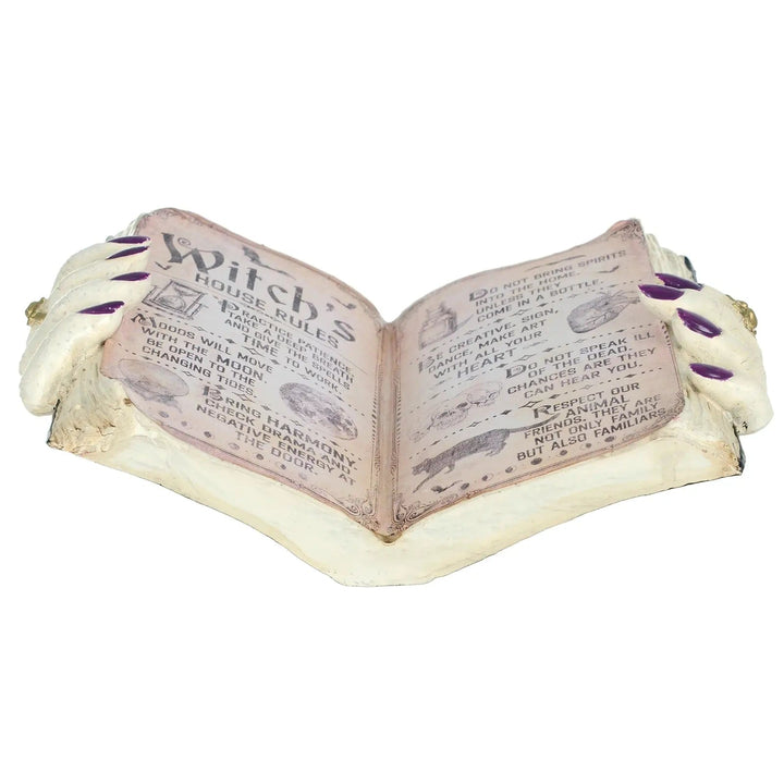 Open book of Witch's House Rules Halloween ornament with hands