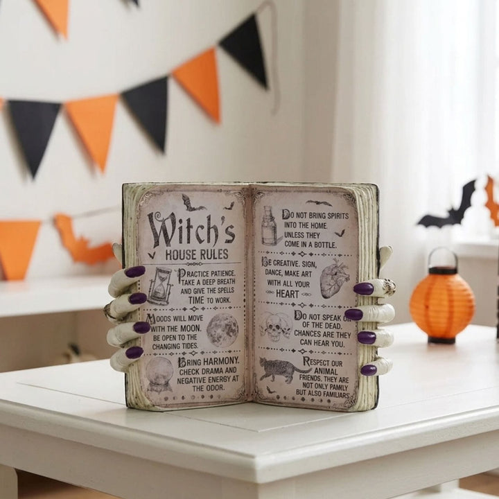A decorative open book sign with &