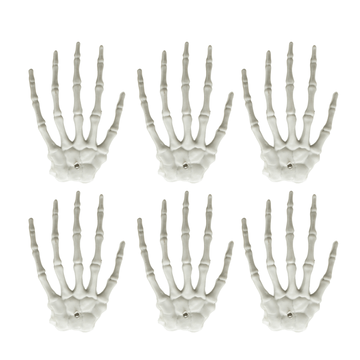 6 mini skeleton hand decorations on white background