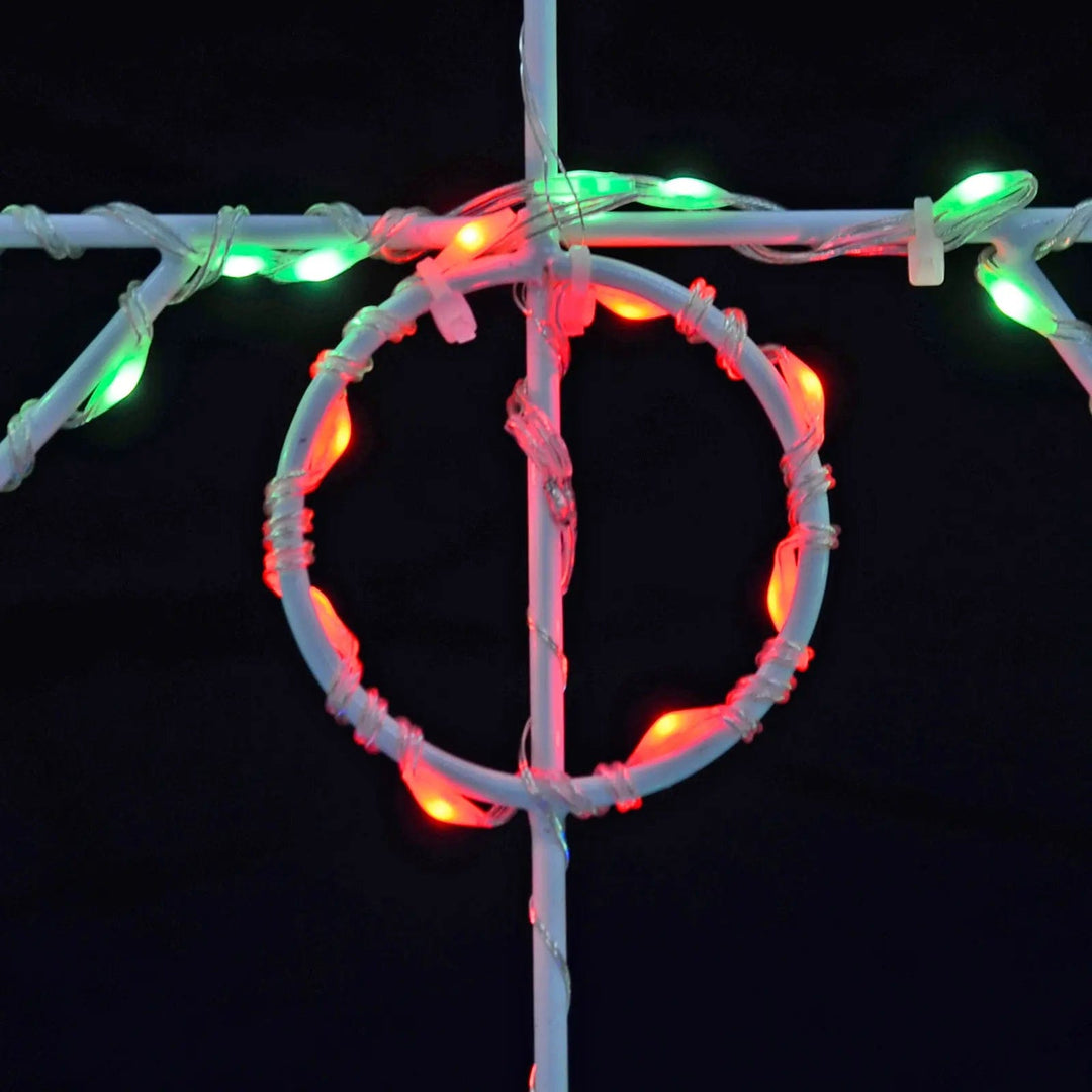 Detail of red and green LED lights on a Christmas tree silhouette light decoration