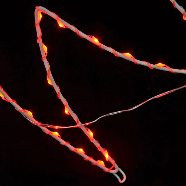 Close up of loop at base of red bow Christmas silhouette light to secure with pegs 