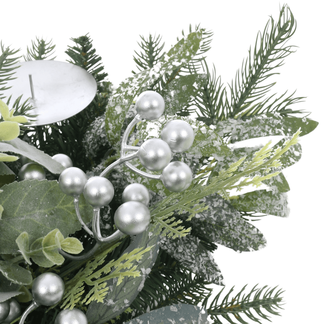 detail shot of silver berries and snow covered foliage