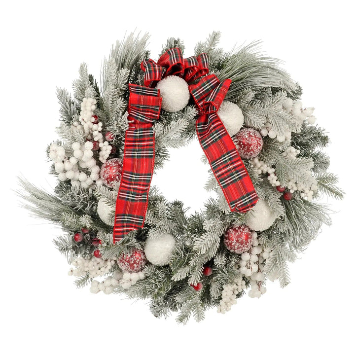 Christmas wreath with red tartan ribbons, frosted pine branches, red and white baubles and berries