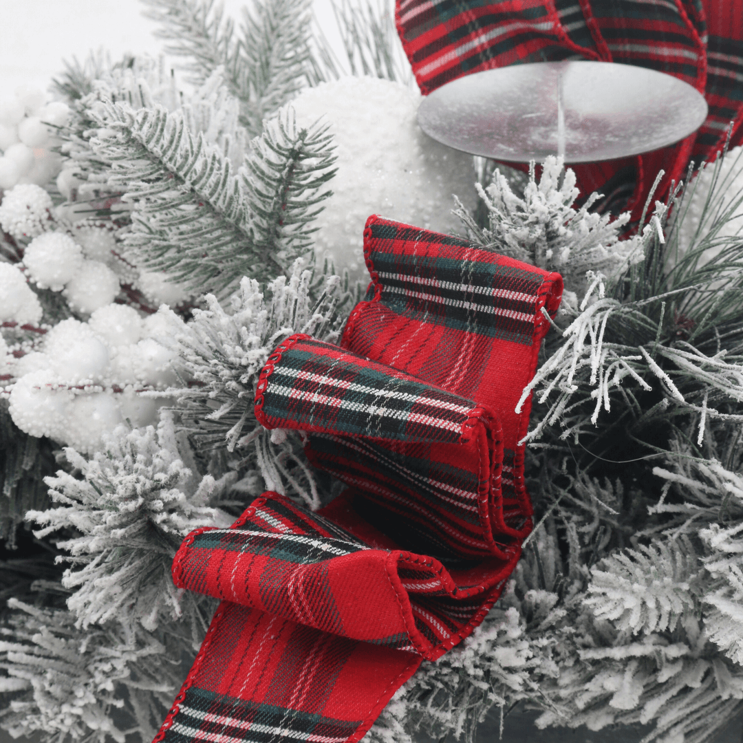 detail shot of red and green tartan bows on centrepiece