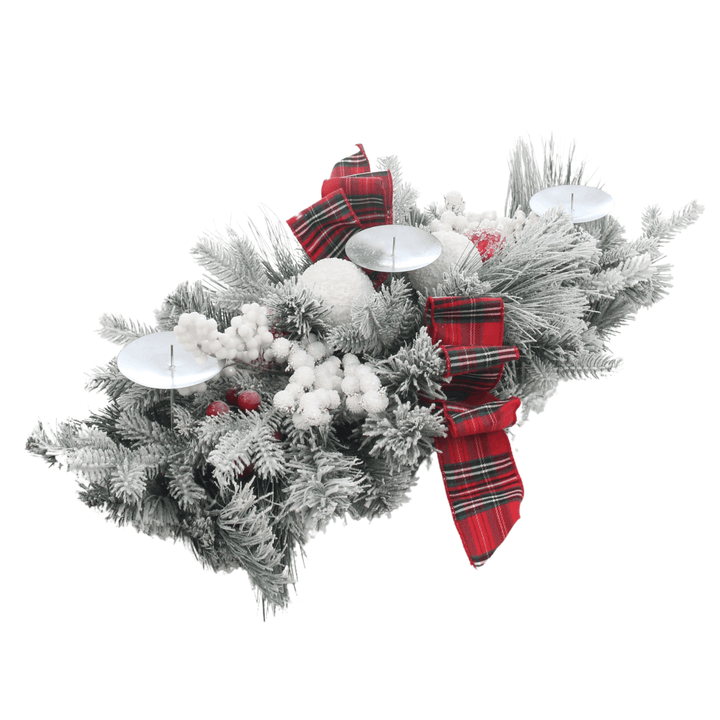 side view of table centrepiece with tartan bows, berries and candle holders