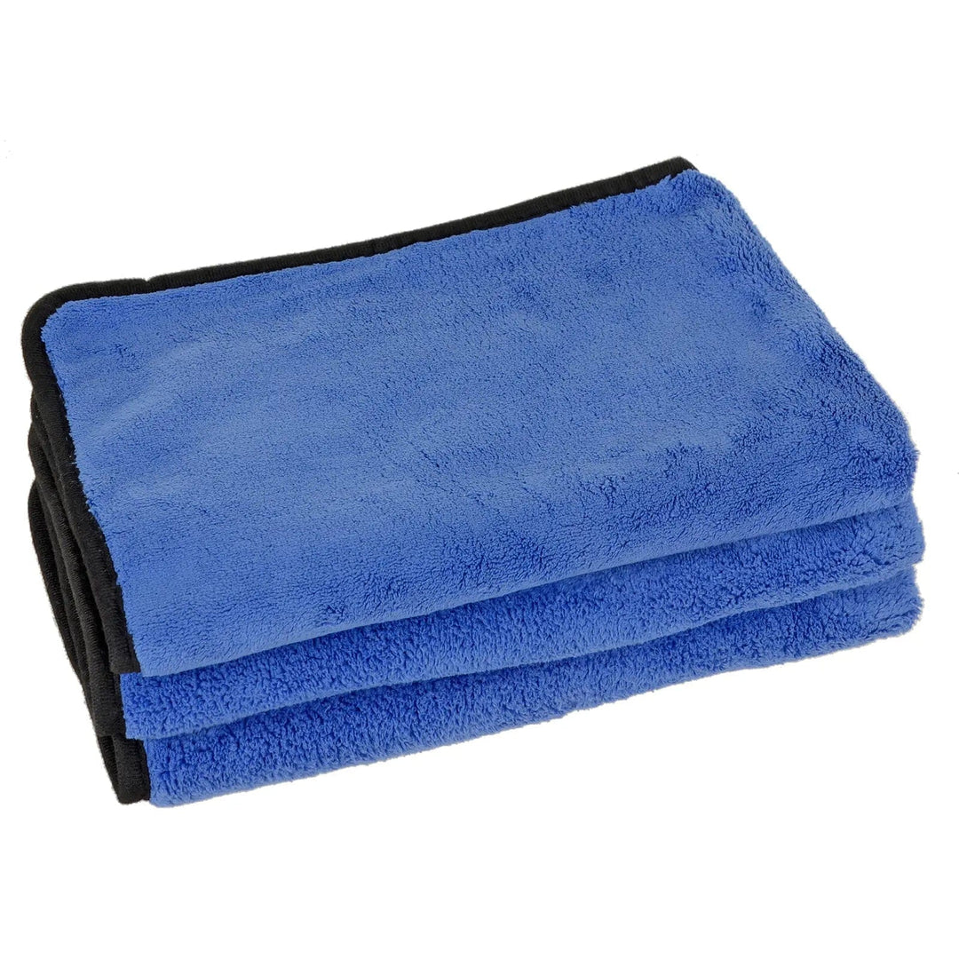 Pile of 3 folded blue buffing towels for car detailing