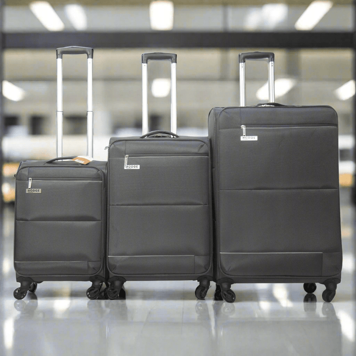 Grey H&amp;H Luggage In airport departure area