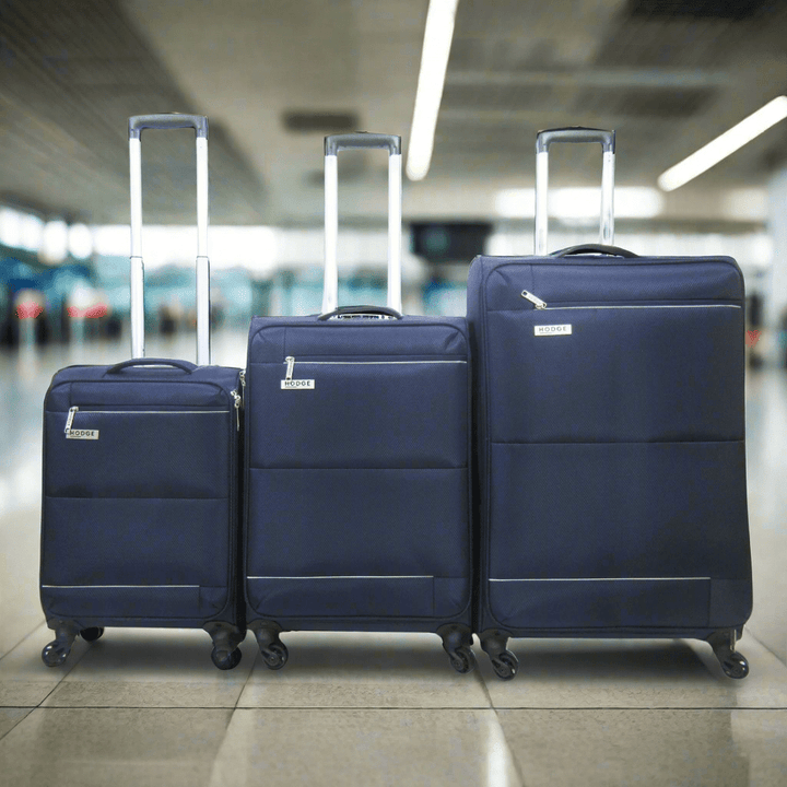 Navy Blue H&amp;H Luggage In airport departure area