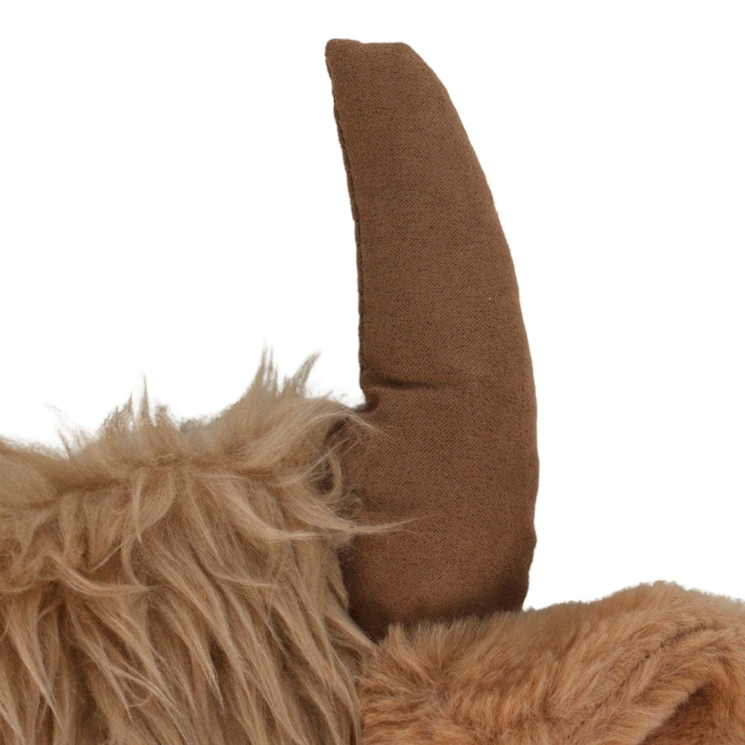 Close-up of a plush stocking with a brown furry texture and large brown horn on a white background.