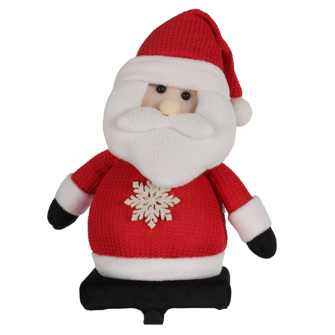 front view of santa stocking holder with snowflake design and plush waffle style hat
