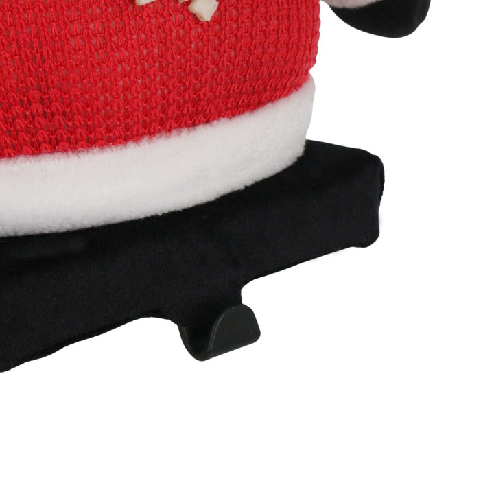 close up of metal hook stocking holder on santa figure